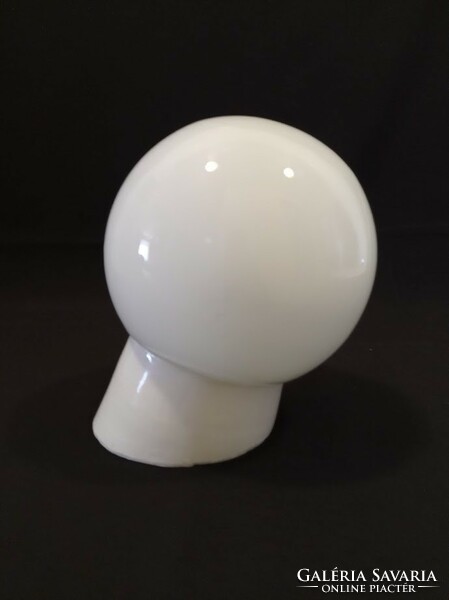 Old porcelain socket wall lamp with glass sphere cover