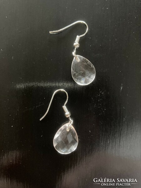 White plastic earrings with a glass effect