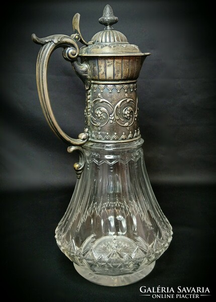 A pair of carafes with a baroque pattern