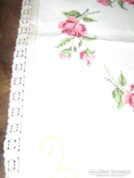 Beautiful vintage pink hand-embroidered woven tablecloth with a lace edge