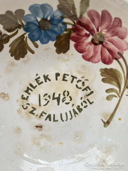 Old, unmarked, painted folk earthenware wall plate with the inscription 