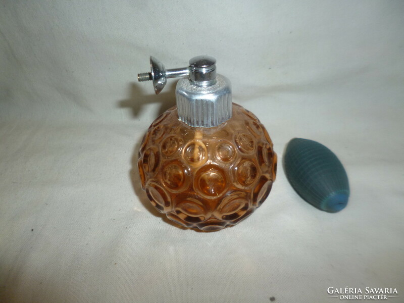 Old glass pump perfume dispenser