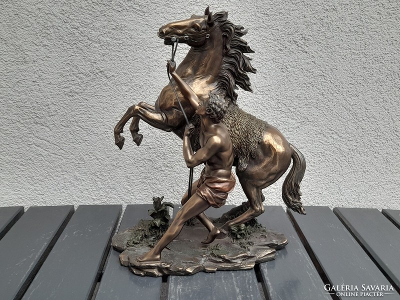 A large, fairy-tale bronzed equestrian statue