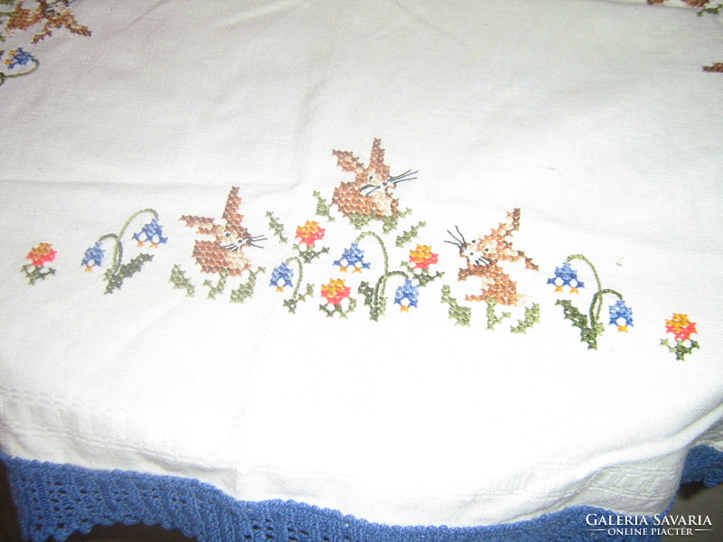 Beautiful embroidered cross-stitch Easter bunny tablecloth with a crocheted edge