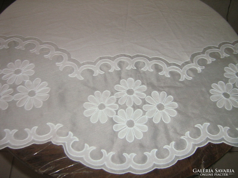 Embroidered filigree tablecloth sewn in beautiful white material