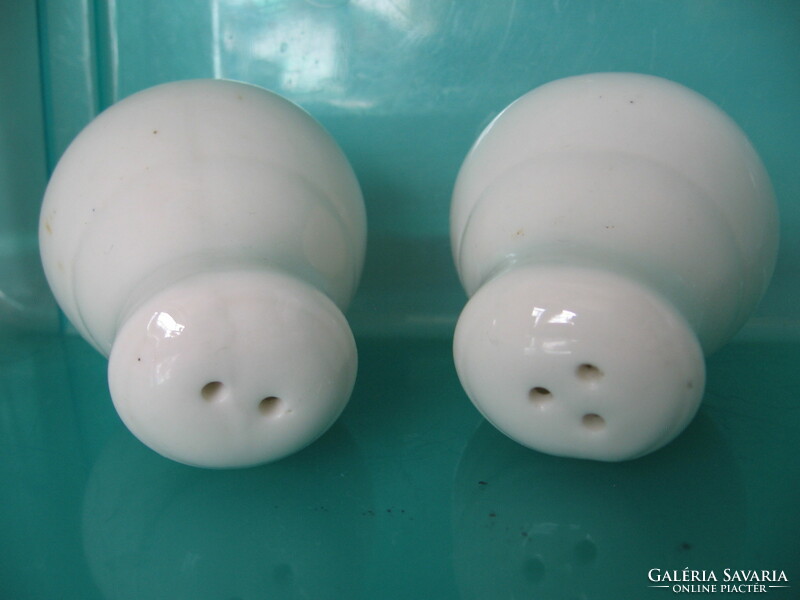 Pair of white porcelain salt, pepper shakers and table spice holders