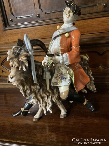 A master tailor riding a goat