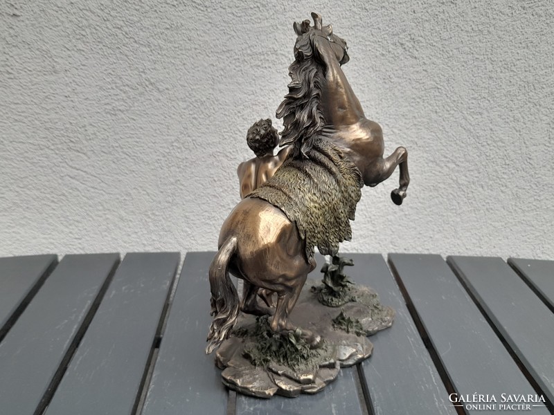A large, fairy-tale bronzed equestrian statue