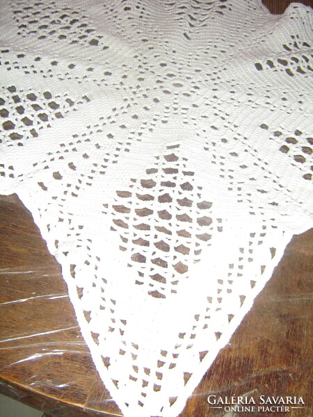 Beautiful hand-crocheted star-shaped white lace tablecloth