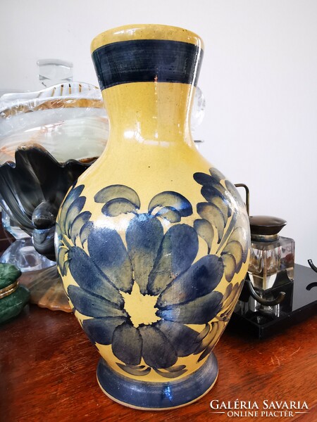 Folk ceramic vase with flowers