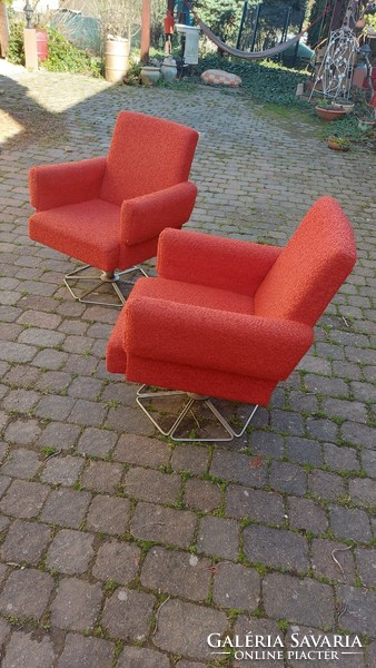 2 retro red swivel armchairs