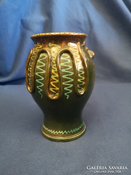Green glazed ceramic decorated with Regi folk motifs