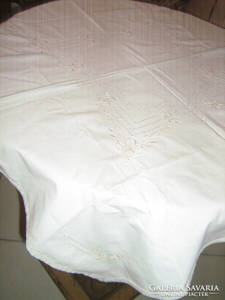 Beautiful cream-colored floral elegant tablecloth embroidered with azure machine