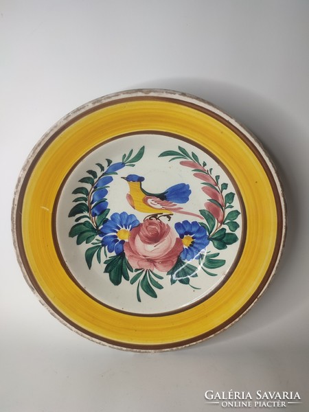 Old miskolcz-marked hard terracotta painted folk wall plate with a bird