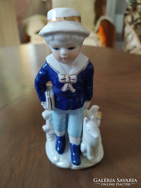 German porcelain figurine of a boy with a dog