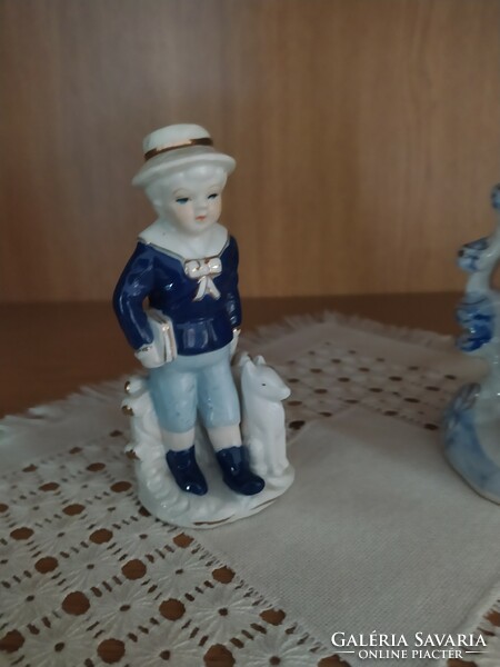 German porcelain figurine of a boy with a dog