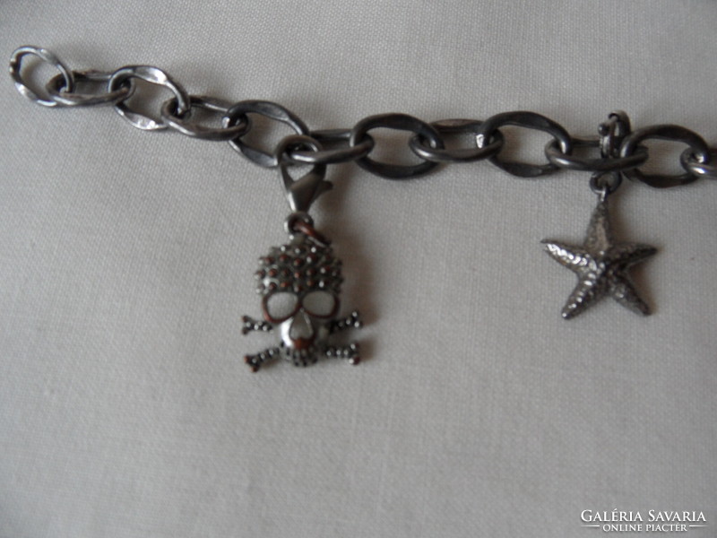 Metal bracelet with miniature figures