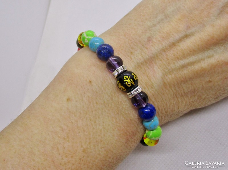 Very nice little rubber chakra bracelet with real stones and maybe glass