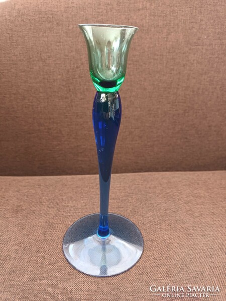 Beautiful graceful thin glass vase with a blue-green transition