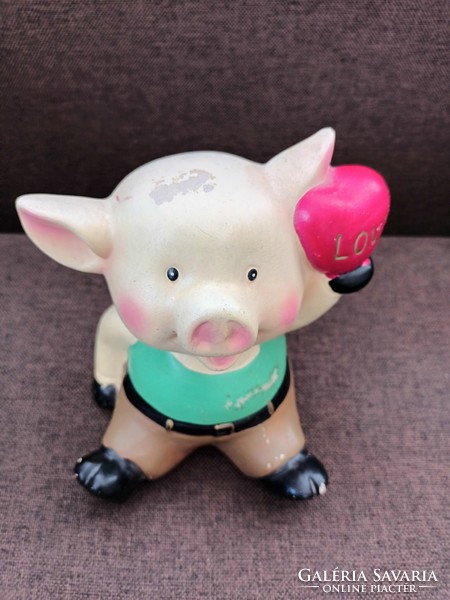 Old cute piggy bank with a smiley face