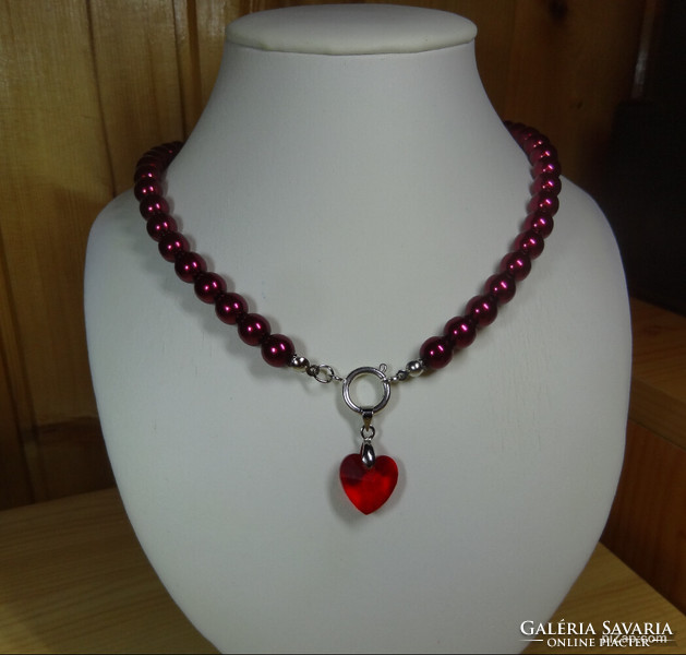 Necklaces made of cherry burgundy beautiful shiny glass beads with swarovski crystal pendants are now fashionable.