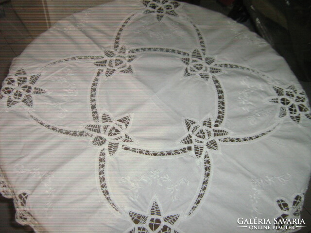 Beautiful ribbon embroidered on white lace tablecloth