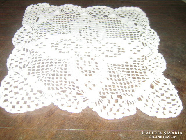 Charming hand-crocheted snow-white tablecloth