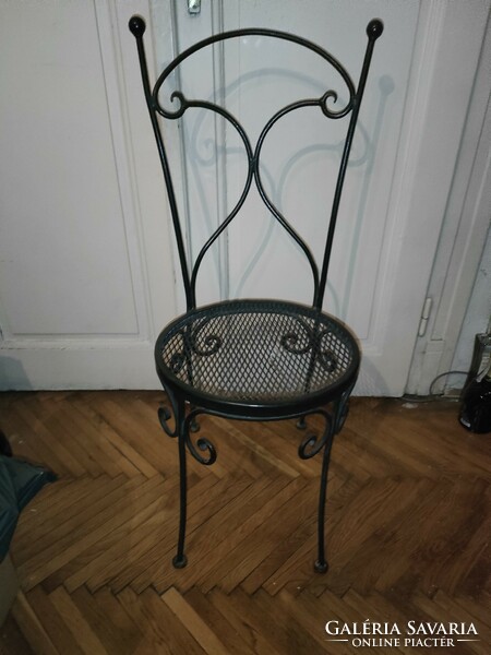 1 iron chair with a small defect