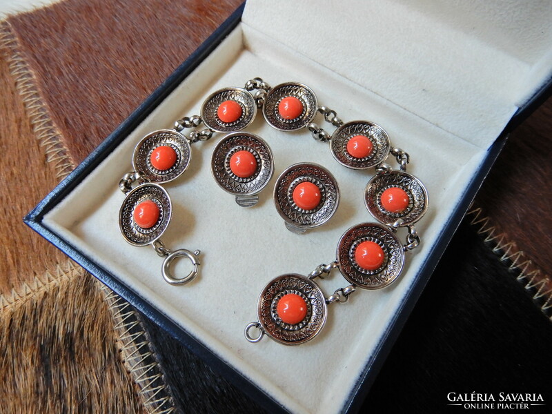 Old metal jewelry set with coral colored stones