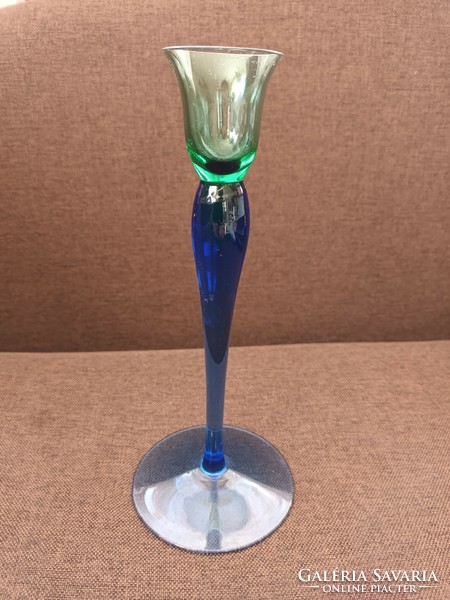 Beautiful graceful thin glass vase with a blue-green transition