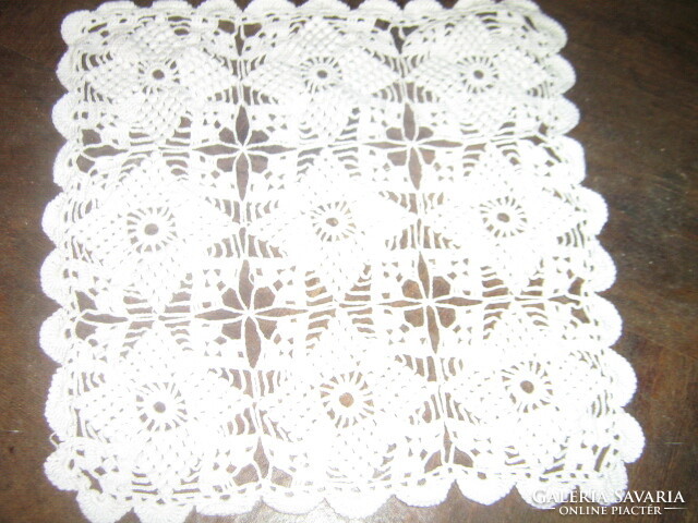Charming hand-crocheted snow-white tablecloth