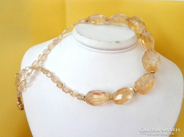 A natural mineral necklace made of large grains of citrine