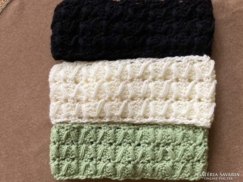 Three crocheted headbands in green, butter and black