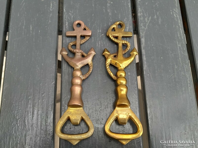 A pair of beautiful solid copper beer openers