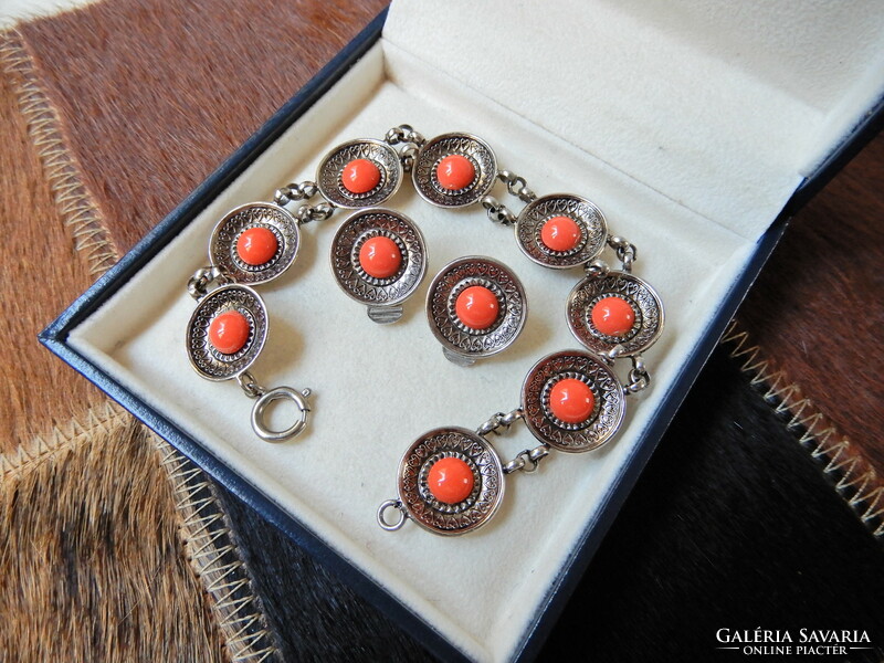 Old metal jewelry set with coral colored stones