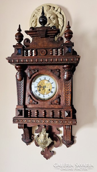 Antique half-baked wall clock from around 1880