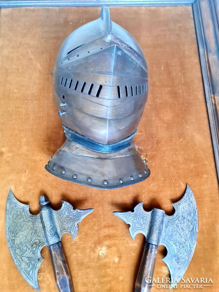 Antique late 19th century historicizing hatchets with armored helmet and gloves on tableau
