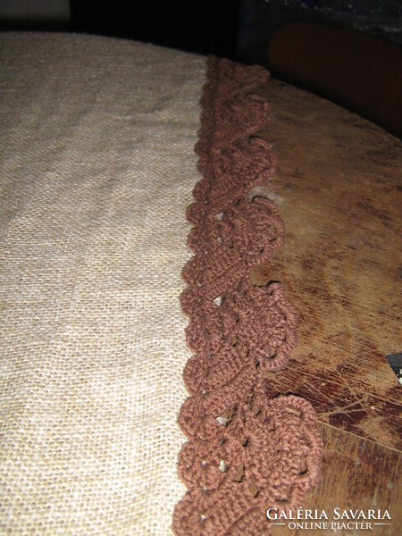 Beautiful taupe hand-crocheted brown woven tablecloth with lace edges and rounded corners