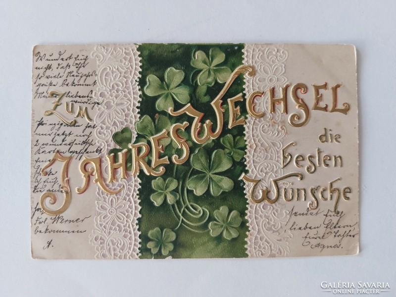 Old embossed postcard with clover lace