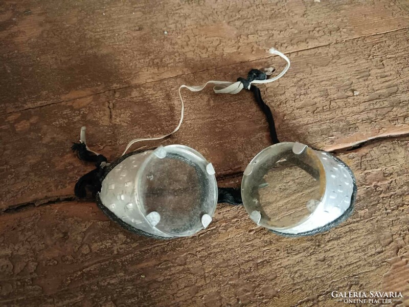 Motorcycle or protective glasses, glass and aluminum combination, maybe car or airplane glasses