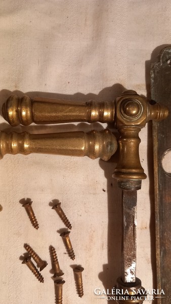 A pair of beautiful, old copper doorknobs, with 4 cylinders and screws