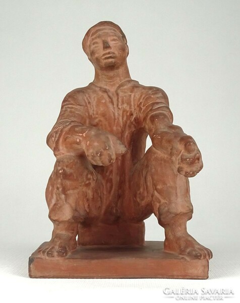 1Q769 Jenő Kerényi: terracotta statue of a bacon-making worker