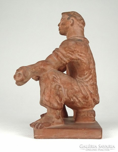 1Q769 Jenő Kerényi: terracotta statue of a bacon-making worker