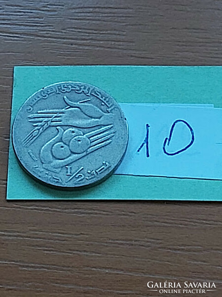 Tunisia 1/2 dinar 1997 1418 copper-nickel, orange 10