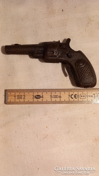 Very old iron plate toy gun in mint condition (works)