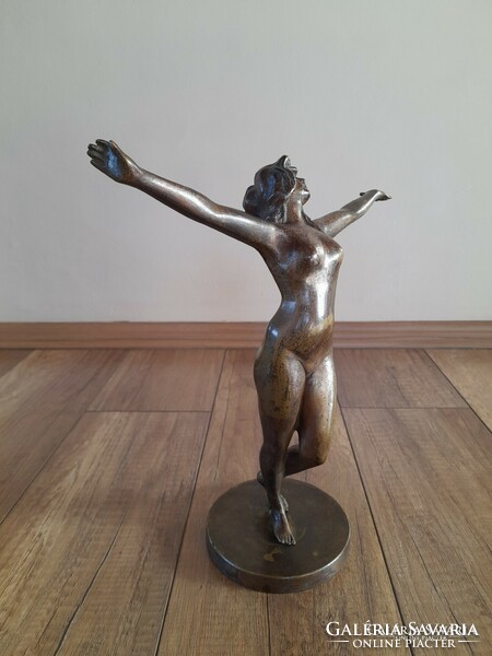 Old bronze dancing nude statue