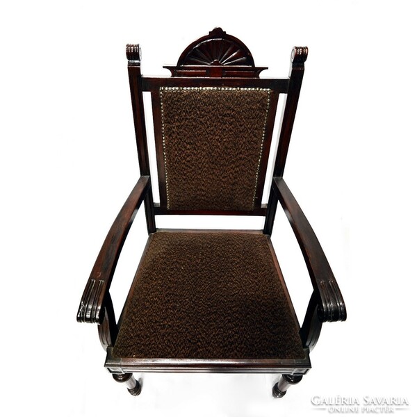 A pewter carved armchair