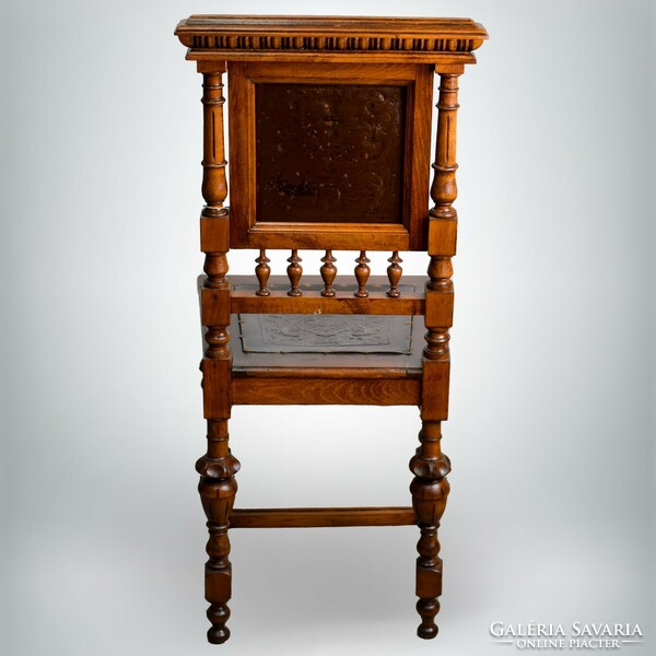 Refurbished antique chair with leather inserts