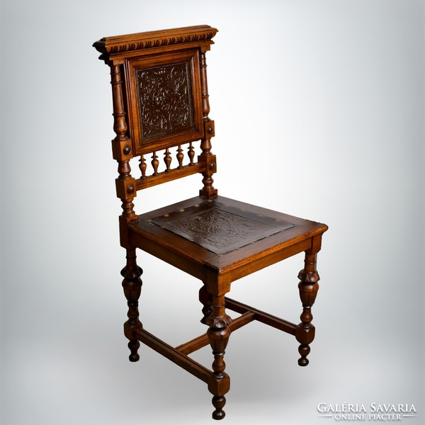 Refurbished antique chair with leather inserts