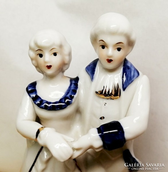 Dancing couple. Porcelain nip. Baroque style with blue painting